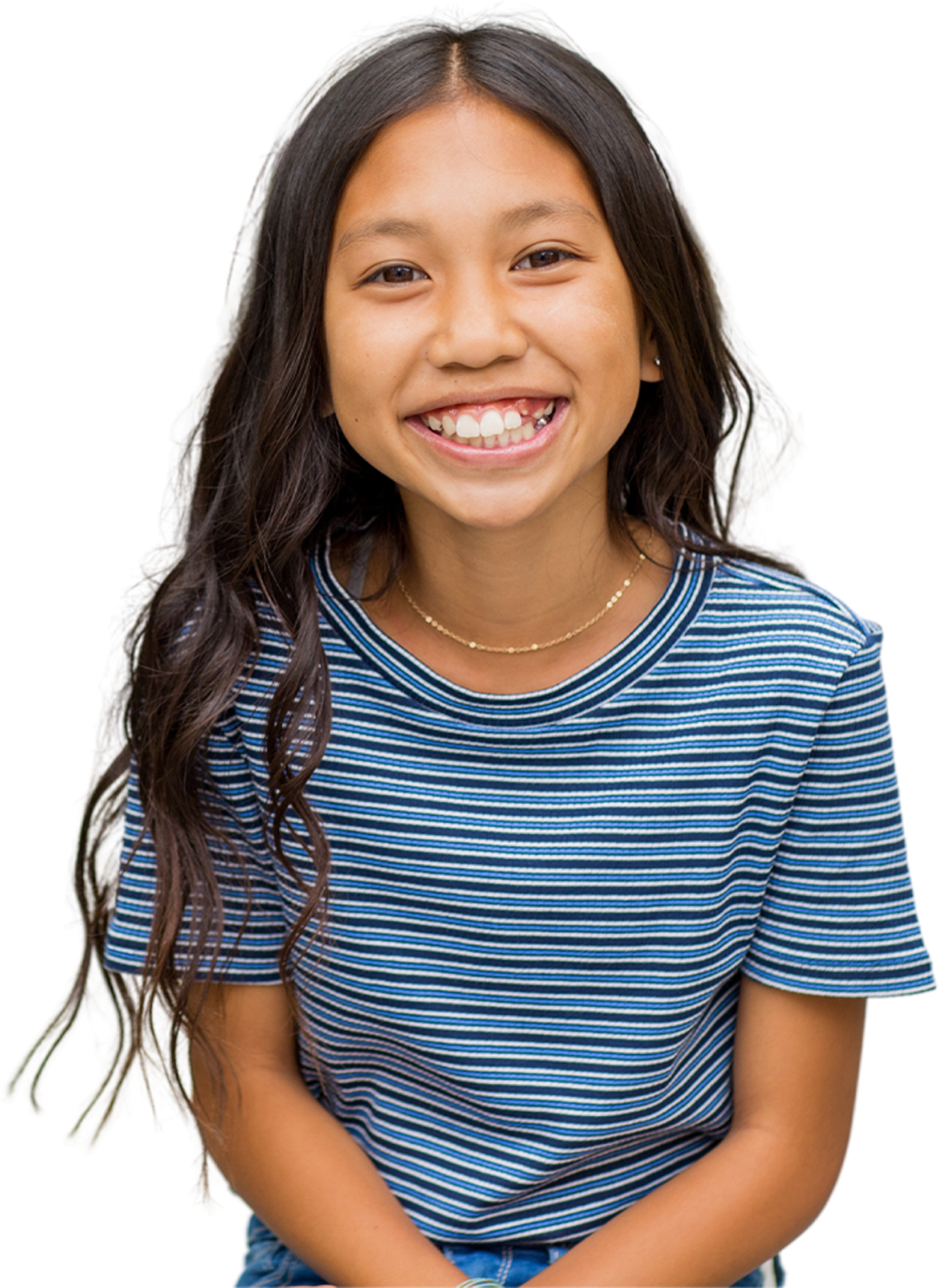 A cutout of a young girl wearing striped shirt, and showing her smile to the camera