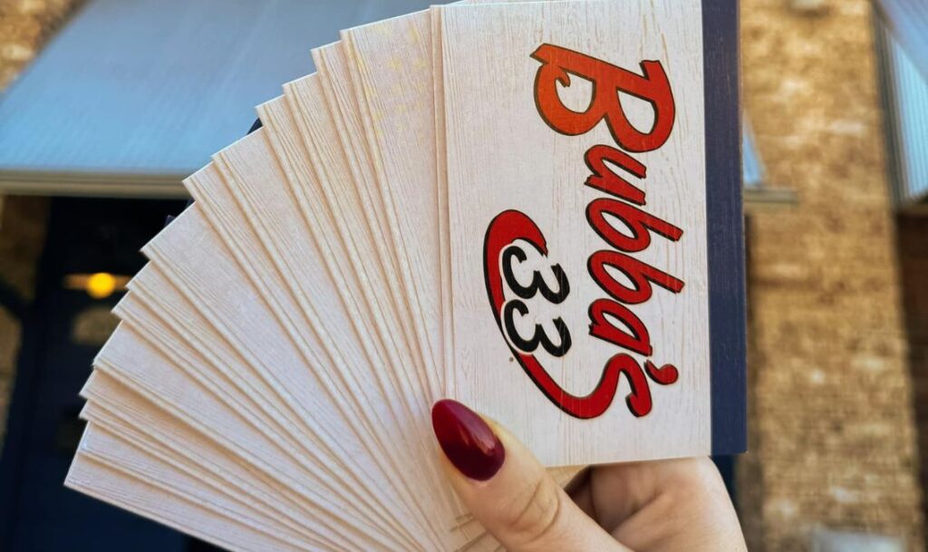 woman holds bubbas 33 gift cards