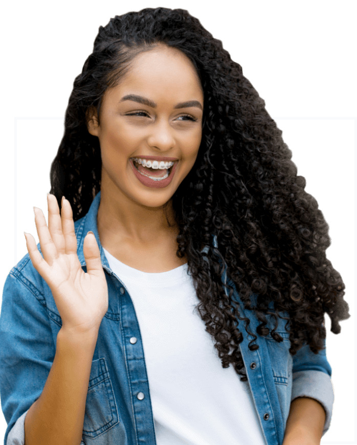 adult smiles and waves after getting braces same day as consultation